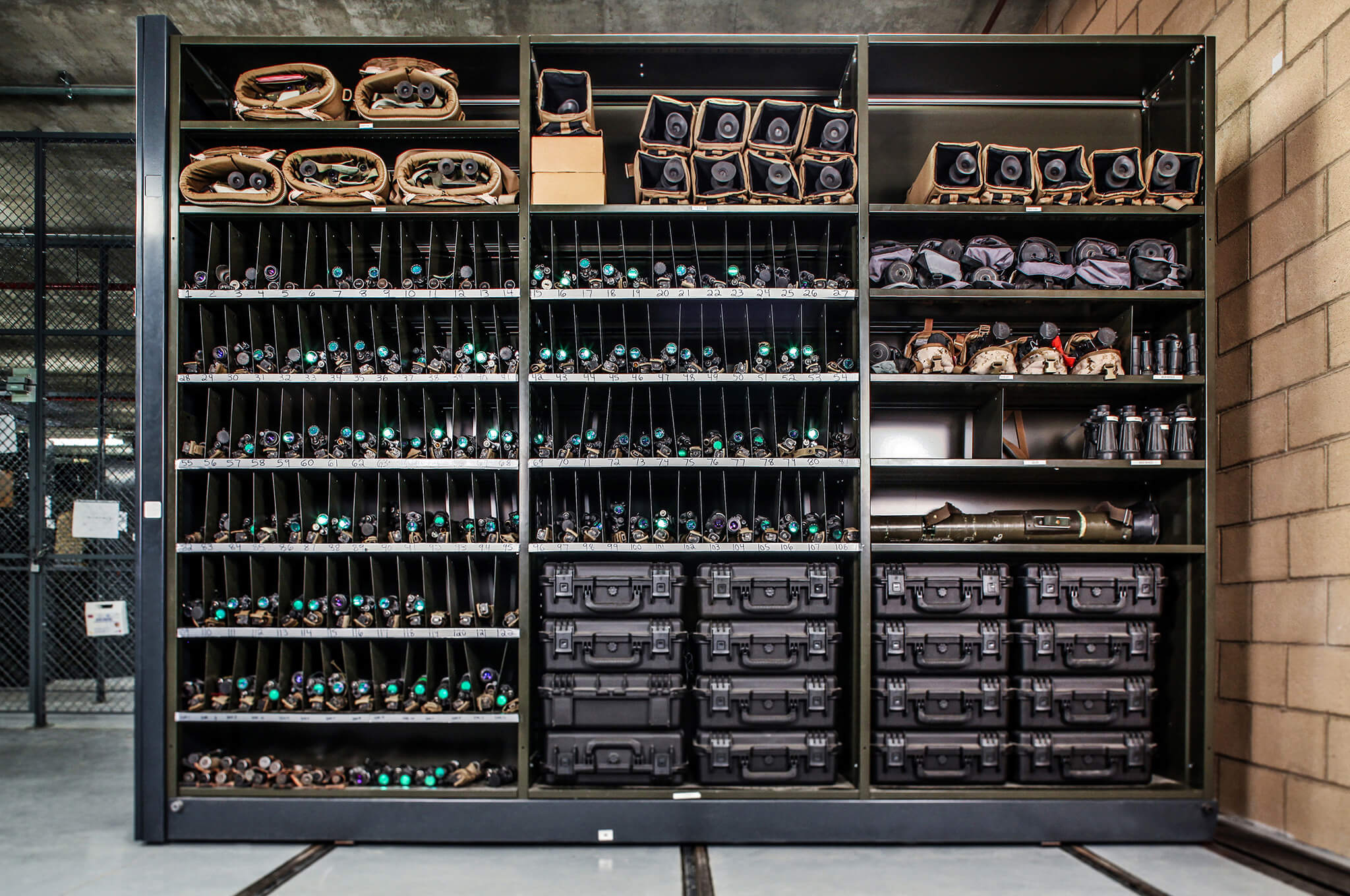 Equipment storage system with shelves filled with tools and parts.