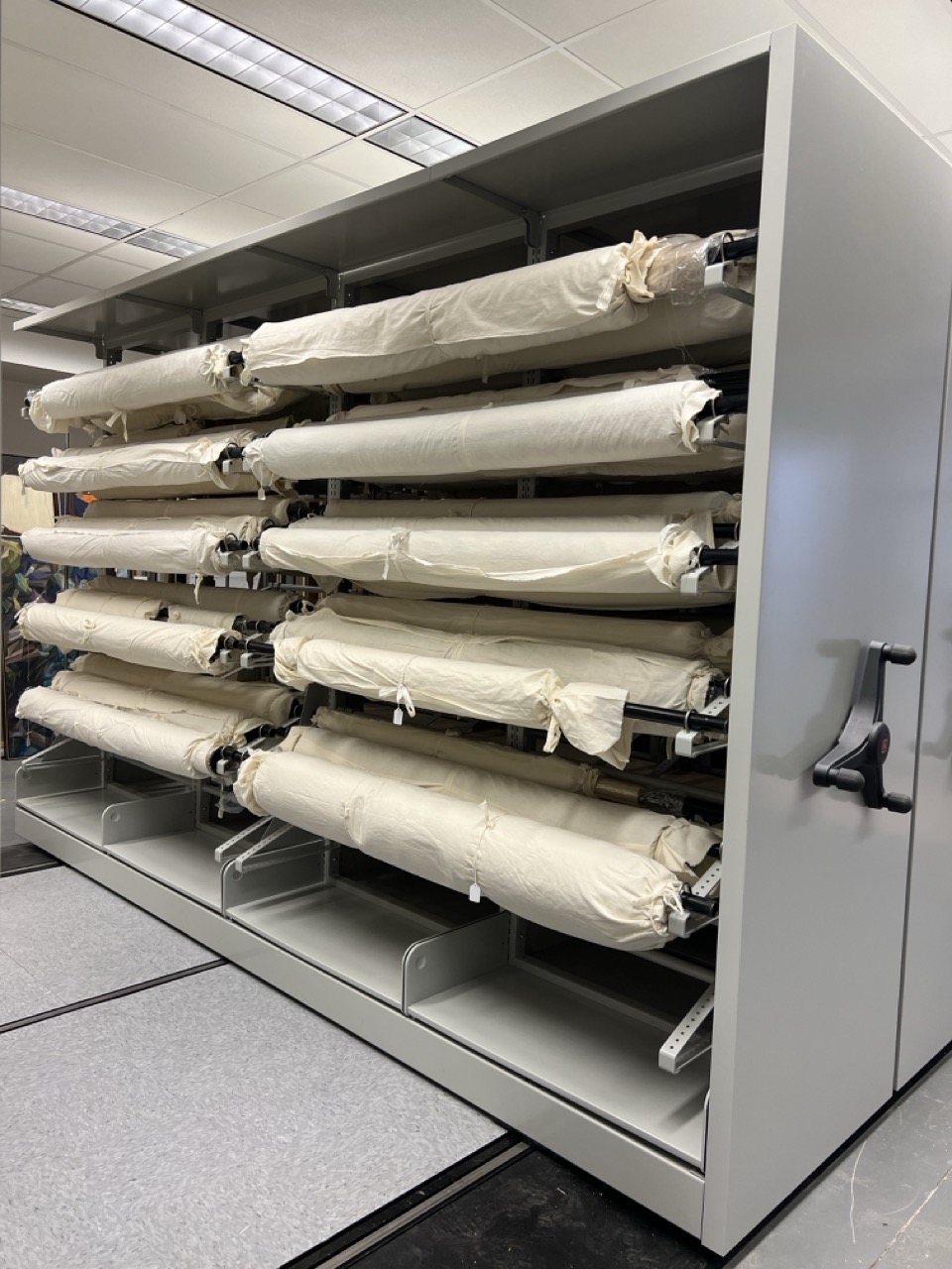 Rangement pour textiles sur rouleaux