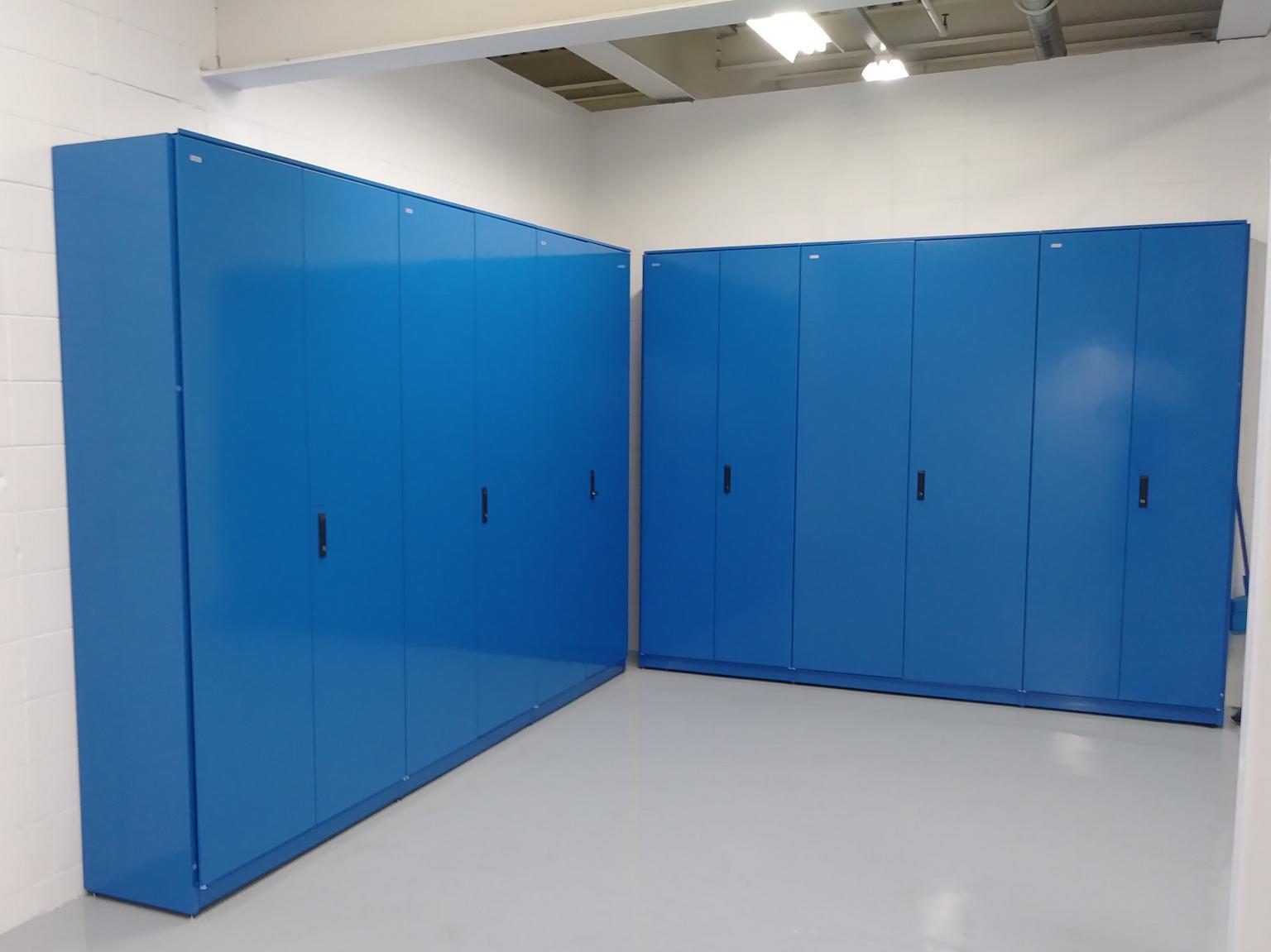 Storage room with blue partitions for space management.