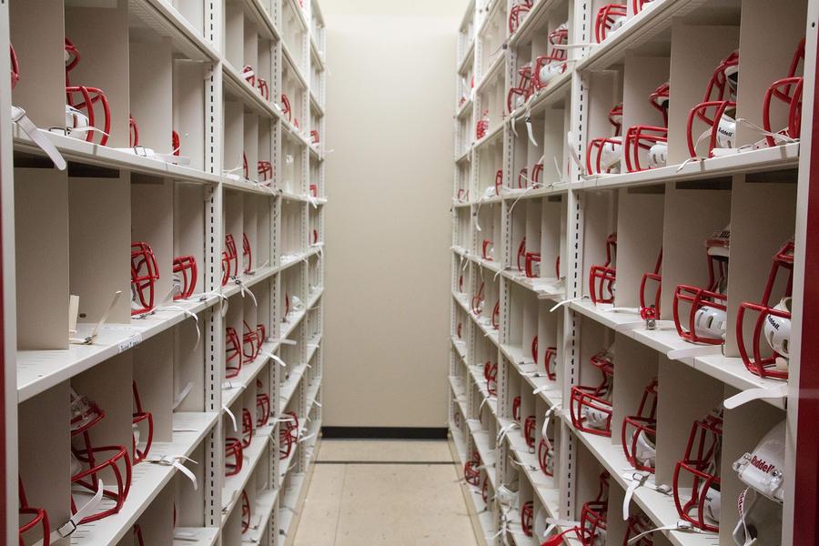 Storage shelves for football helmet grills.